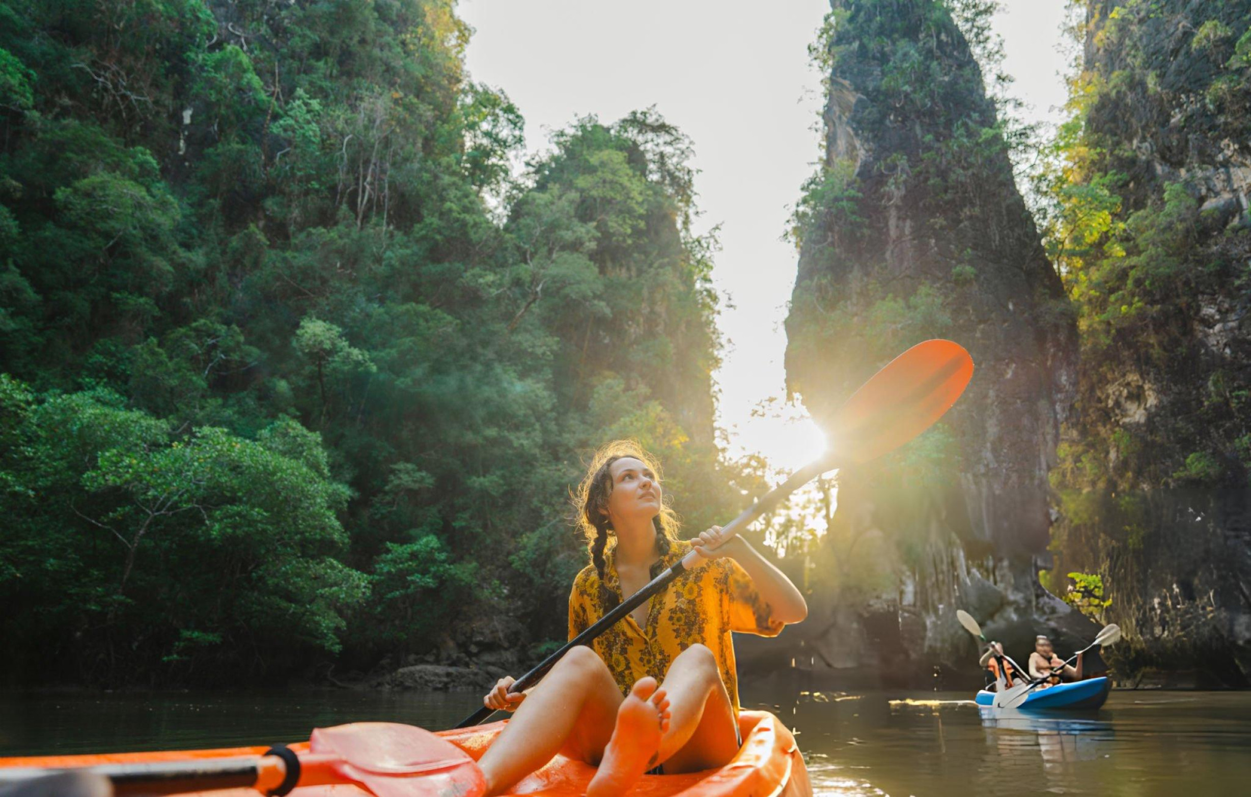 Kayaking among limestone cliffs in Thailand